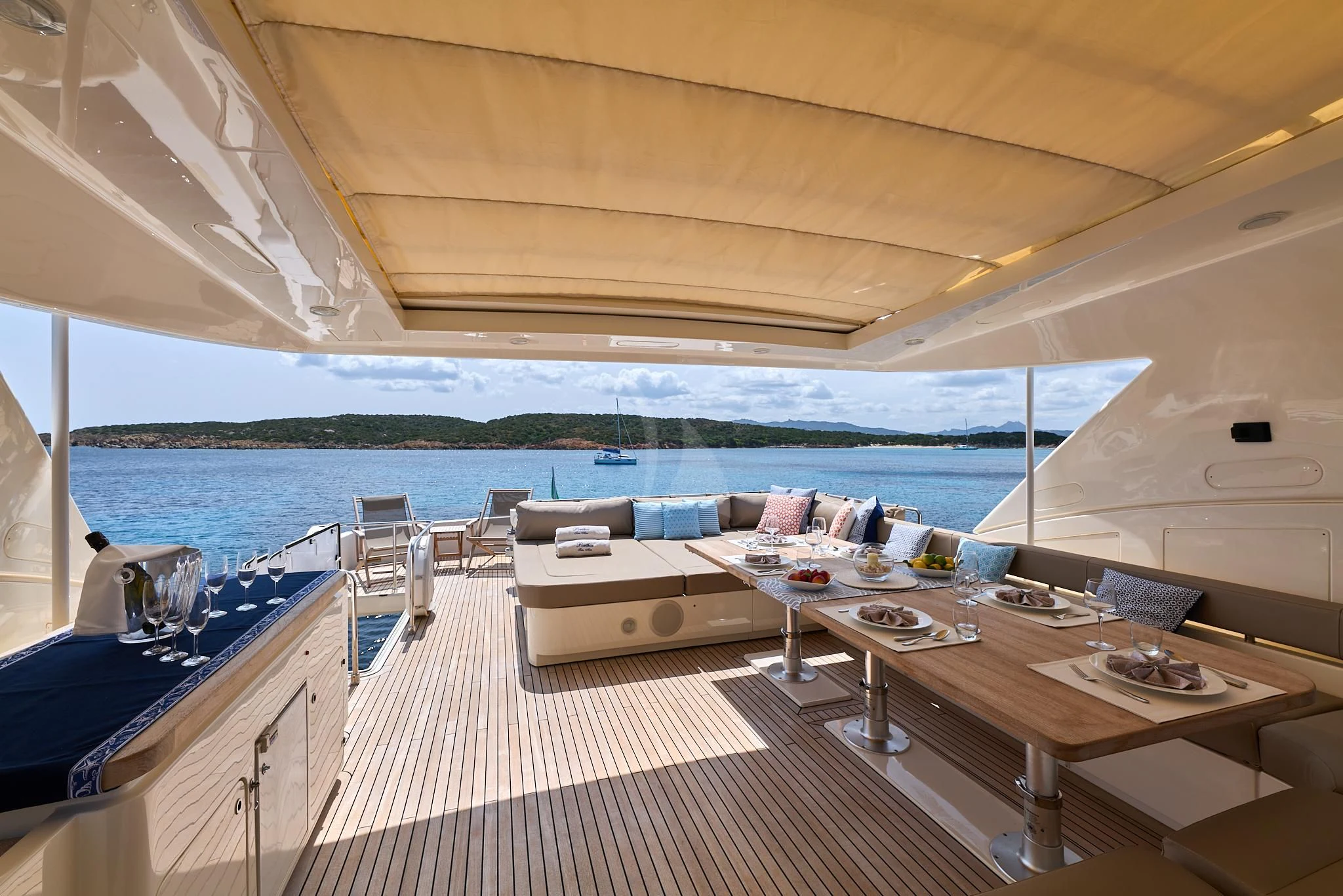 a room with a table and chairs aboard PORTHOS SANS ABRI Yacht for Sale
