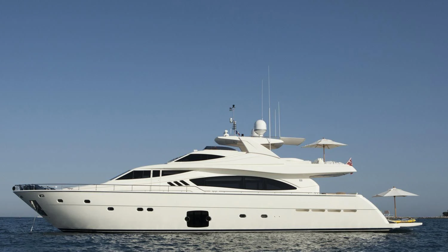 a white yacht in the water aboard PORTHOS SANS ABRI Yacht for Sale