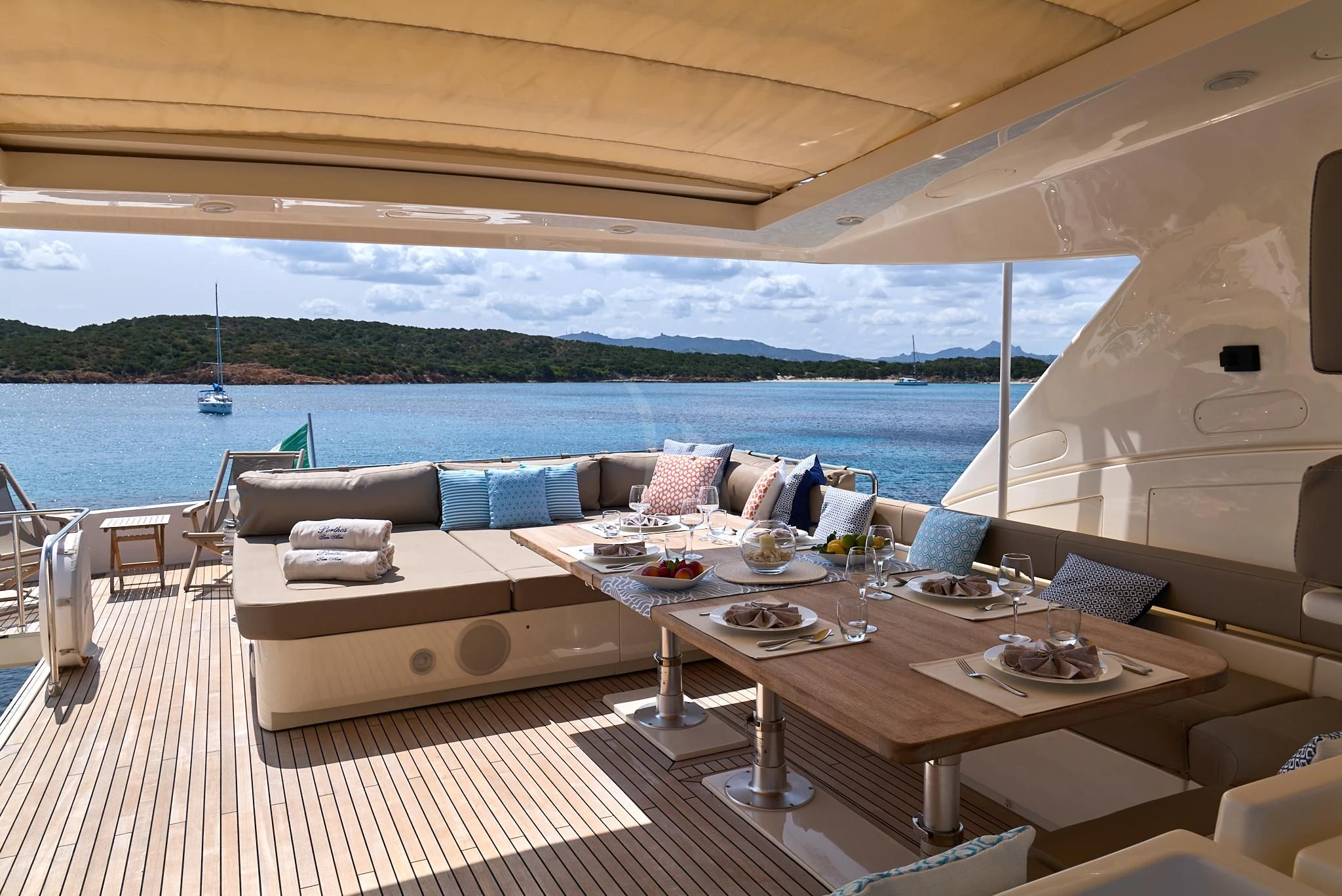 a room with a table and chairs on it aboard PORTHOS SANS ABRI Yacht for Sale