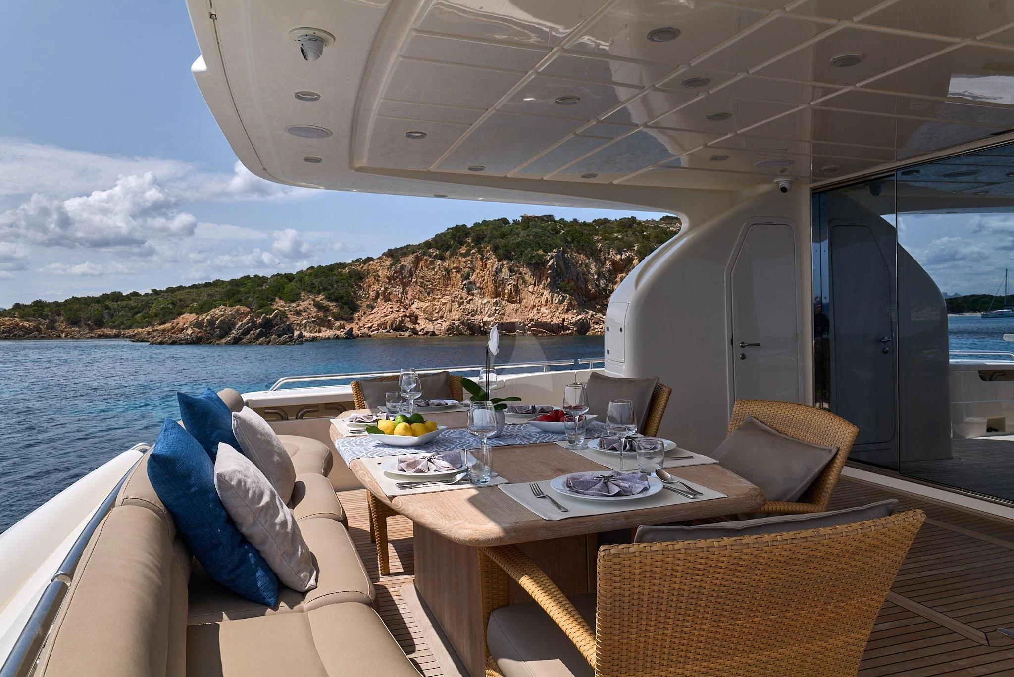 a table and chairs on a boat aboard PORTHOS SANS ABRI Yacht for Sale