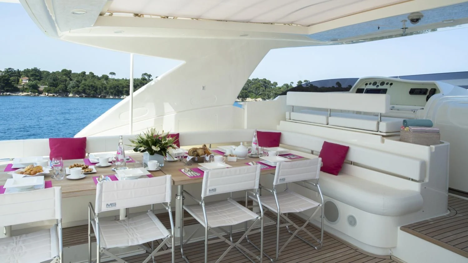 a table set for a meal aboard PORTHOS SANS ABRI Yacht for Sale