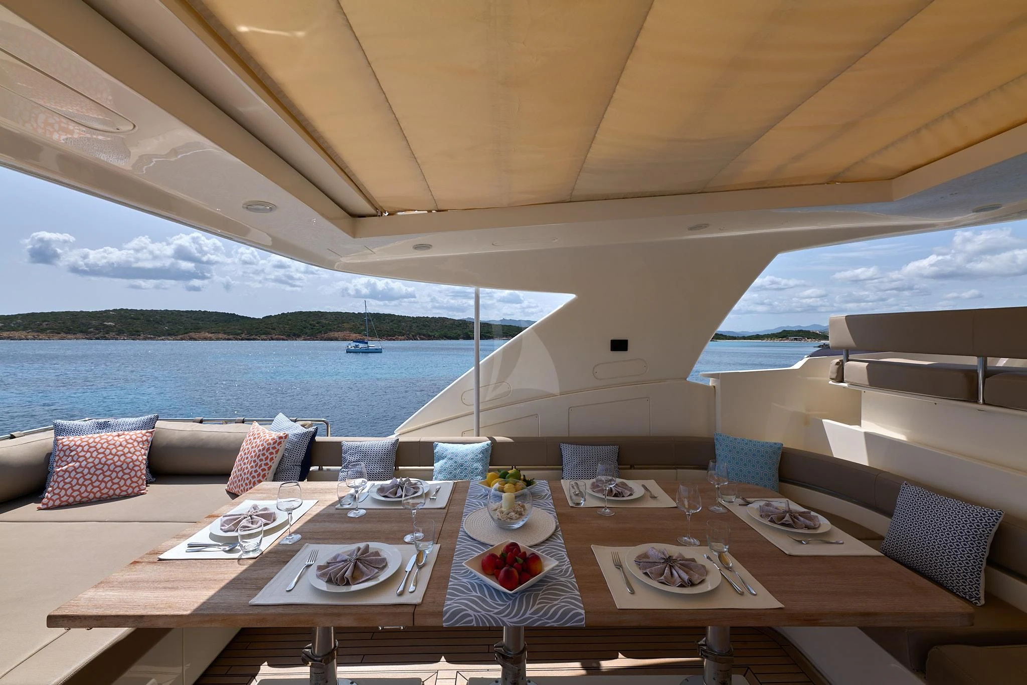 a table set for a meal on a boat aboard PORTHOS SANS ABRI Yacht for Sale