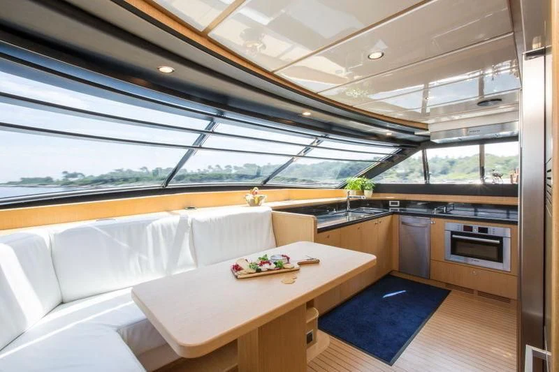 a modern kitchen with a large window aboard PORTHOS SANS ABRI Yacht for Sale
