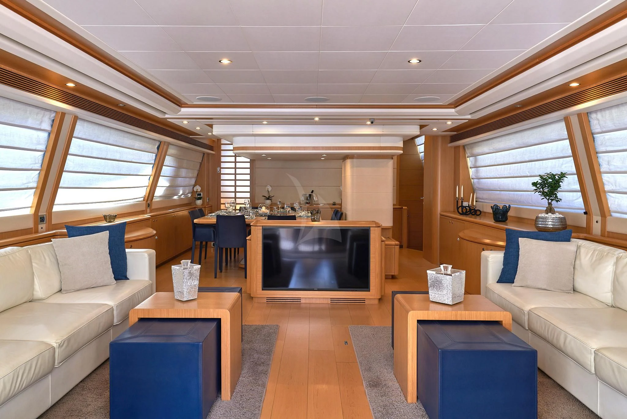 a living room with a fireplace aboard PORTHOS SANS ABRI Yacht for Sale