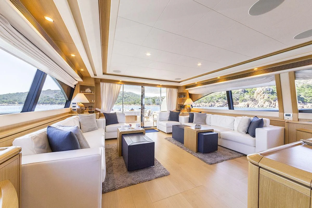 a living room with a large window aboard PORTHOS SANS ABRI Yacht for Sale