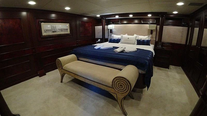 a room with a bed and a chair aboard AGA 6 Yacht for Sale