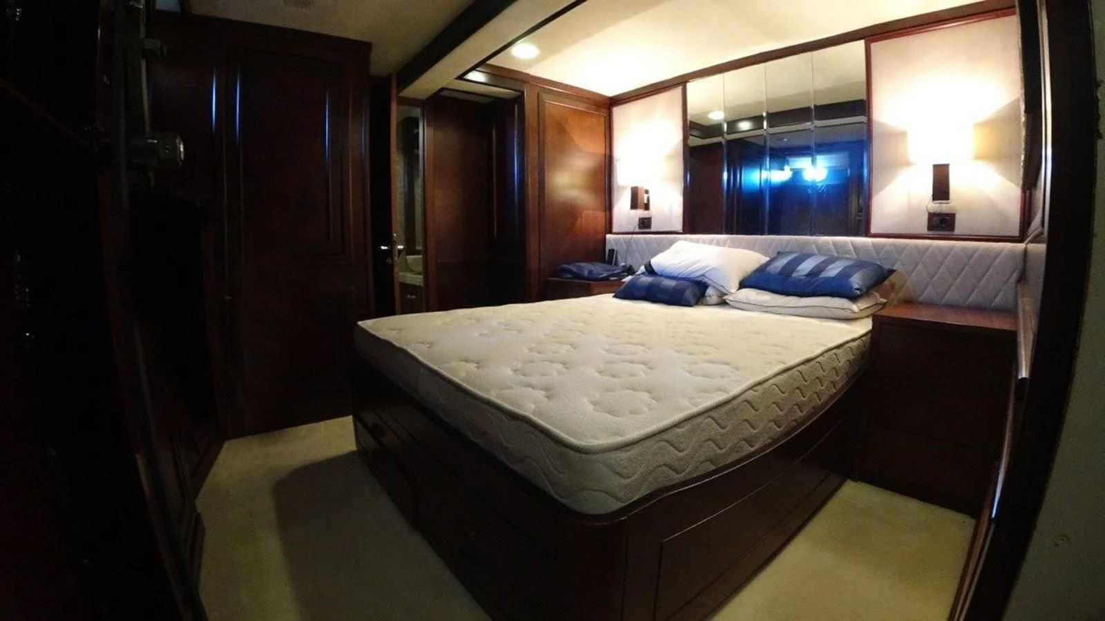 a room with a bed and a mirror aboard AGA 6 Yacht for Sale