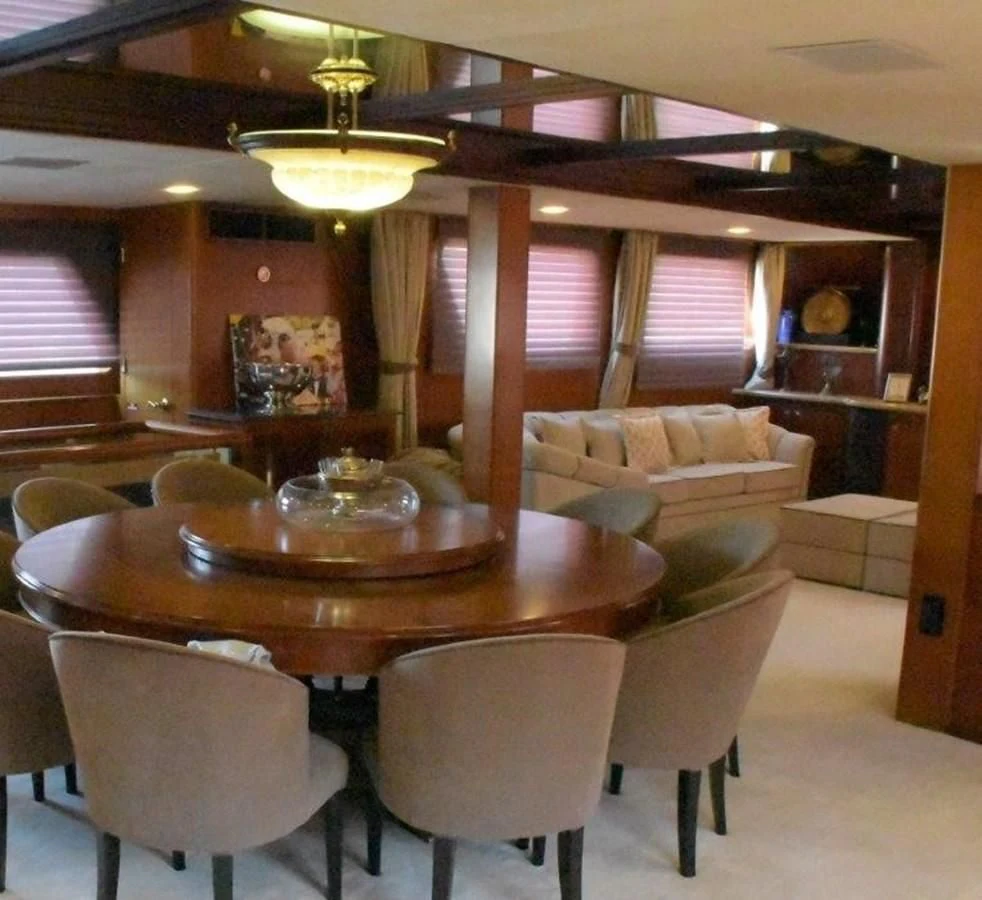 a room with a table and chairs aboard AGA 6 Yacht for Sale