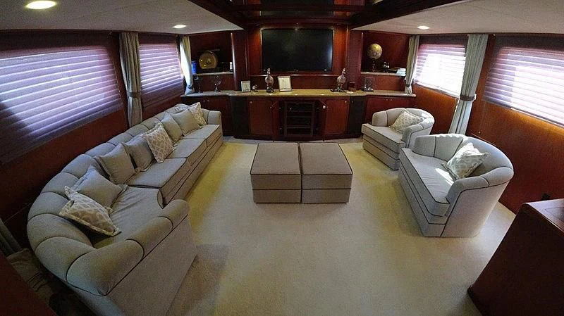 a living room with a couch and a tv aboard AGA 6 Yacht for Sale