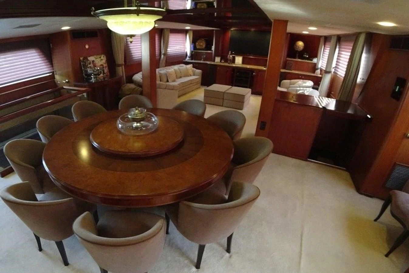 a room with a table and chairs aboard AGA 6 Yacht for Sale