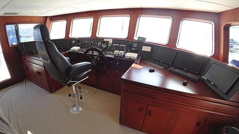 a room with a desk and computer aboard AGA 6 Yacht for Sale