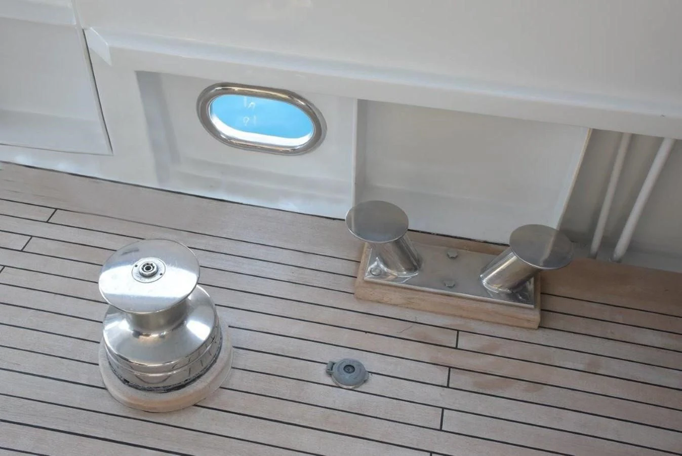 a white and silver object on a wooden surface aboard AGA 6 Yacht for Sale