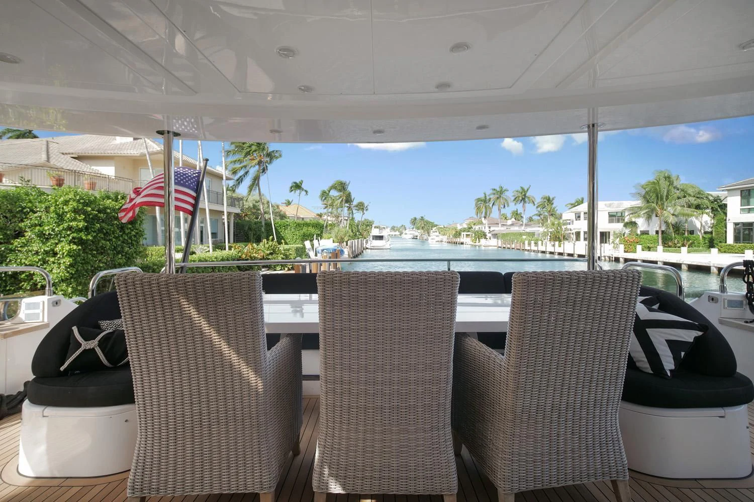 a group of chairs and tables outside a building aboard AGA 6 Yacht for Sale