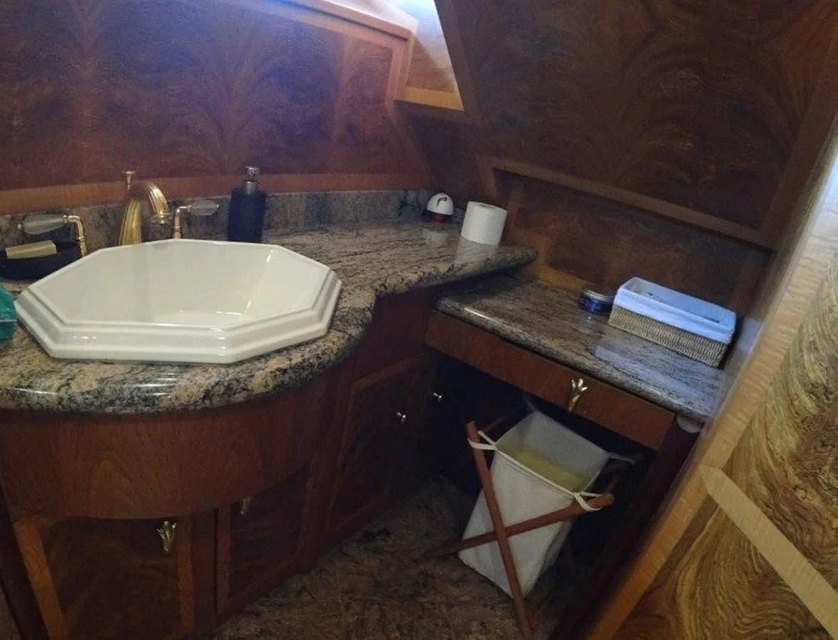 a bathroom with a sink and a mirror aboard AGA 6 Yacht for Sale