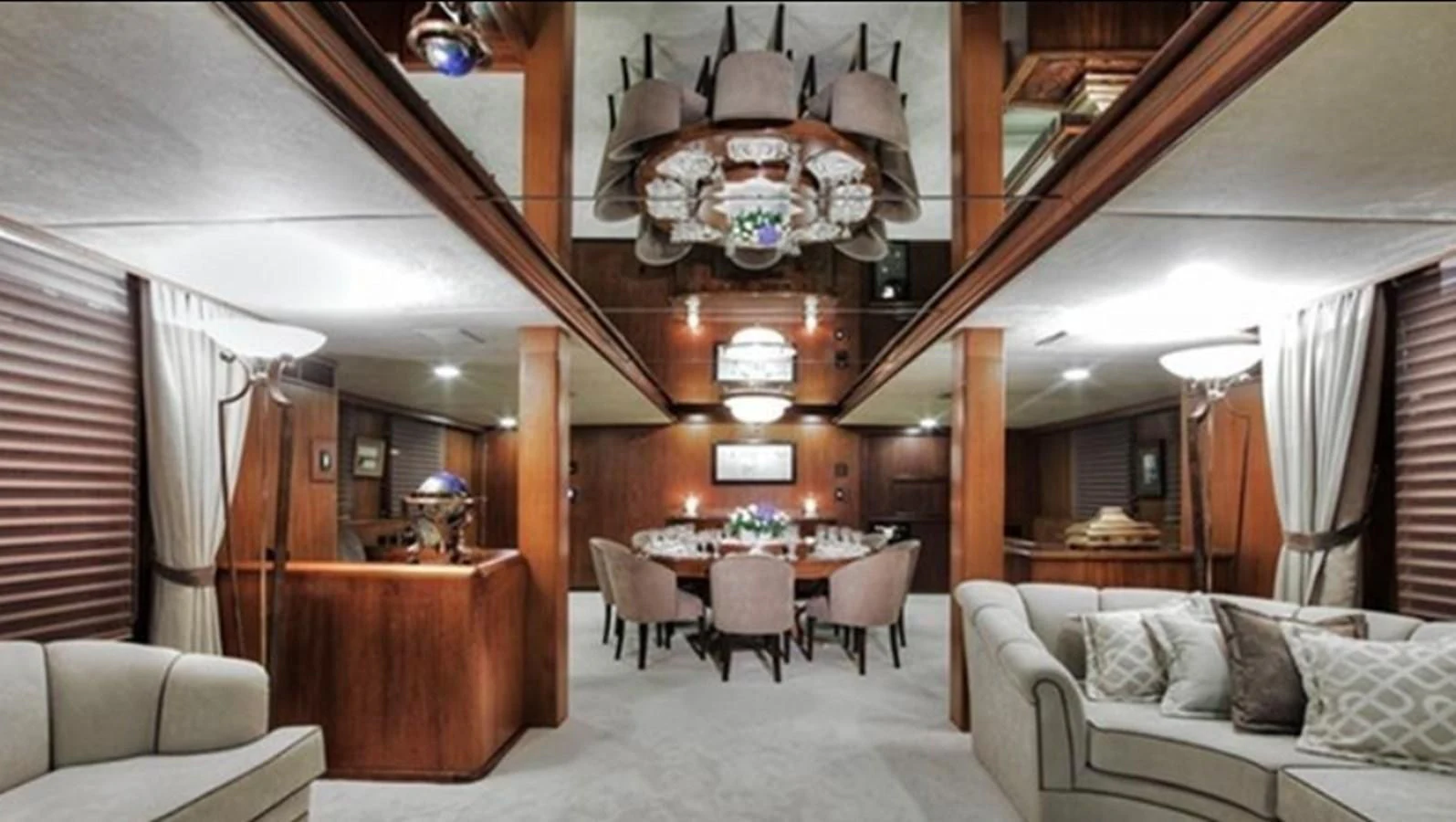 a room with a table and chairs aboard AGA 6 Yacht for Sale