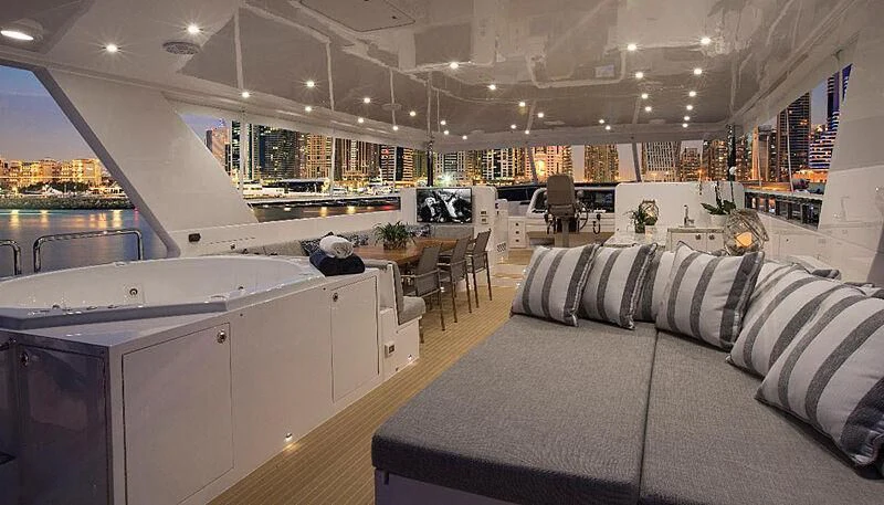 a living room with a couch and a table aboard SEASEID Yacht for Sale