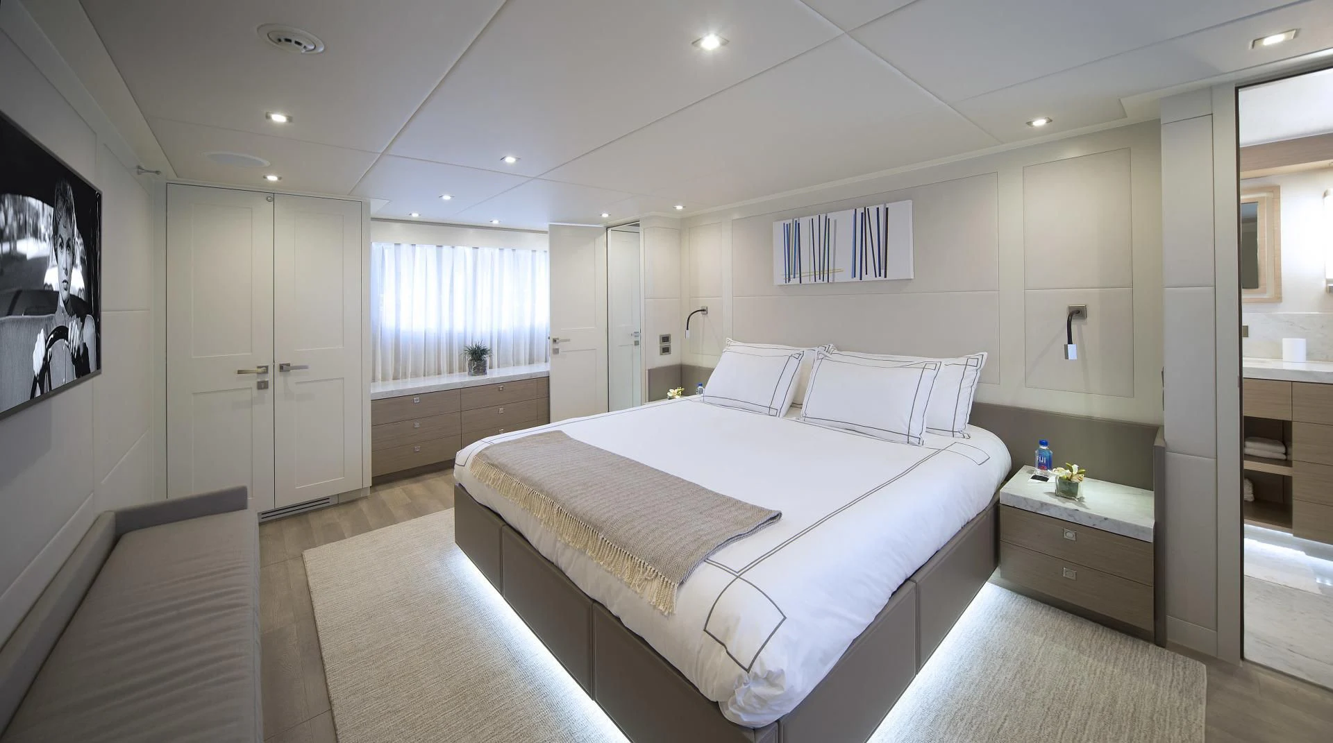 a bedroom with a bed and a desk aboard SEASEID Yacht for Sale