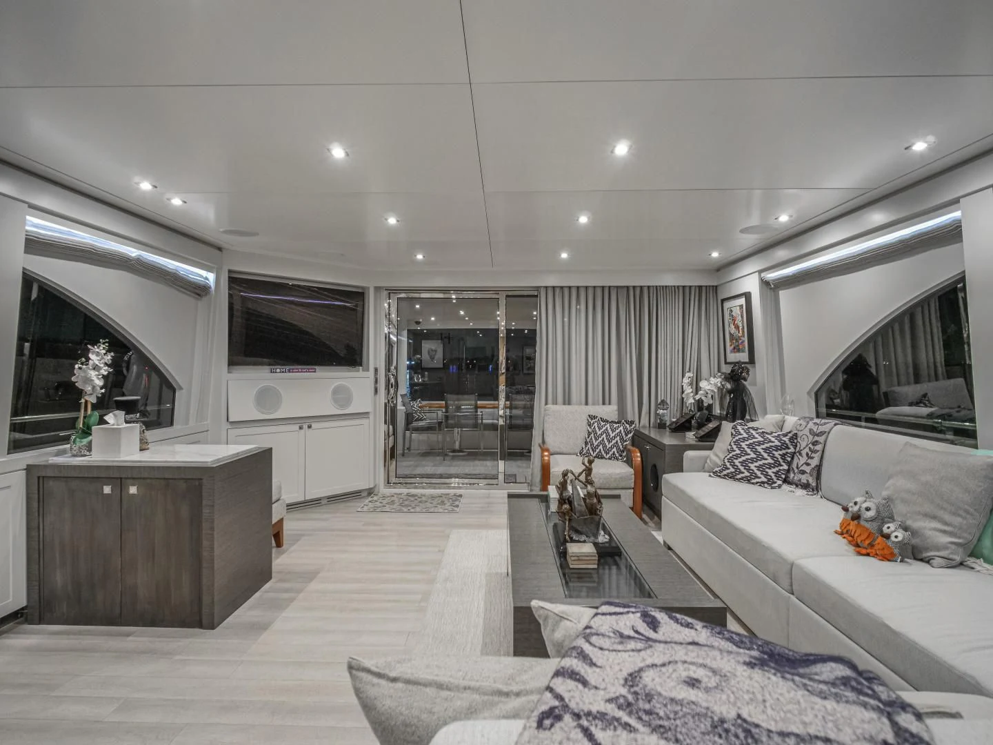 a living room with a white couch and a tv aboard SEASEID Yacht for Sale
