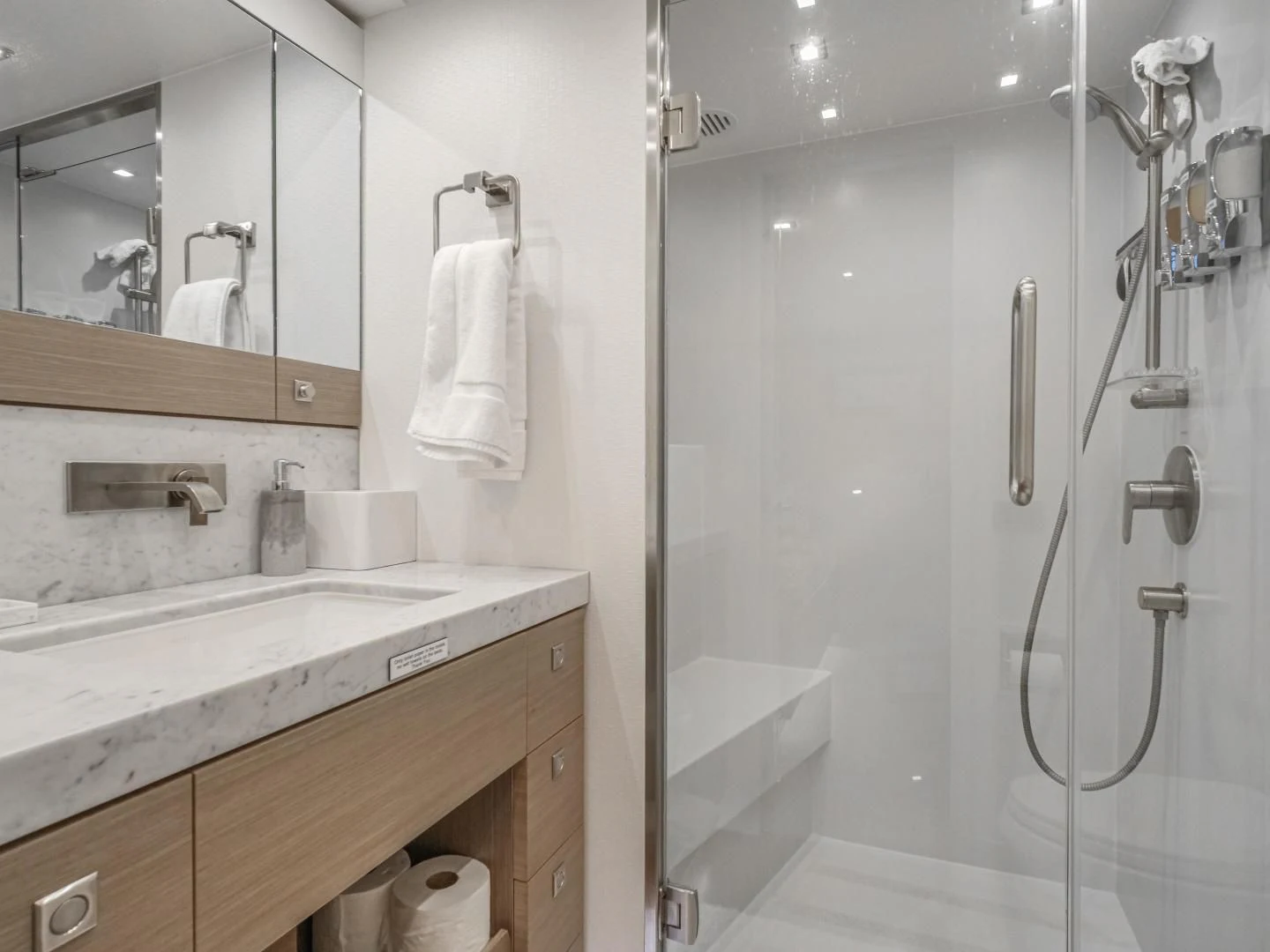 a bathroom with a shower unit and sink aboard SEASEID Yacht for Sale