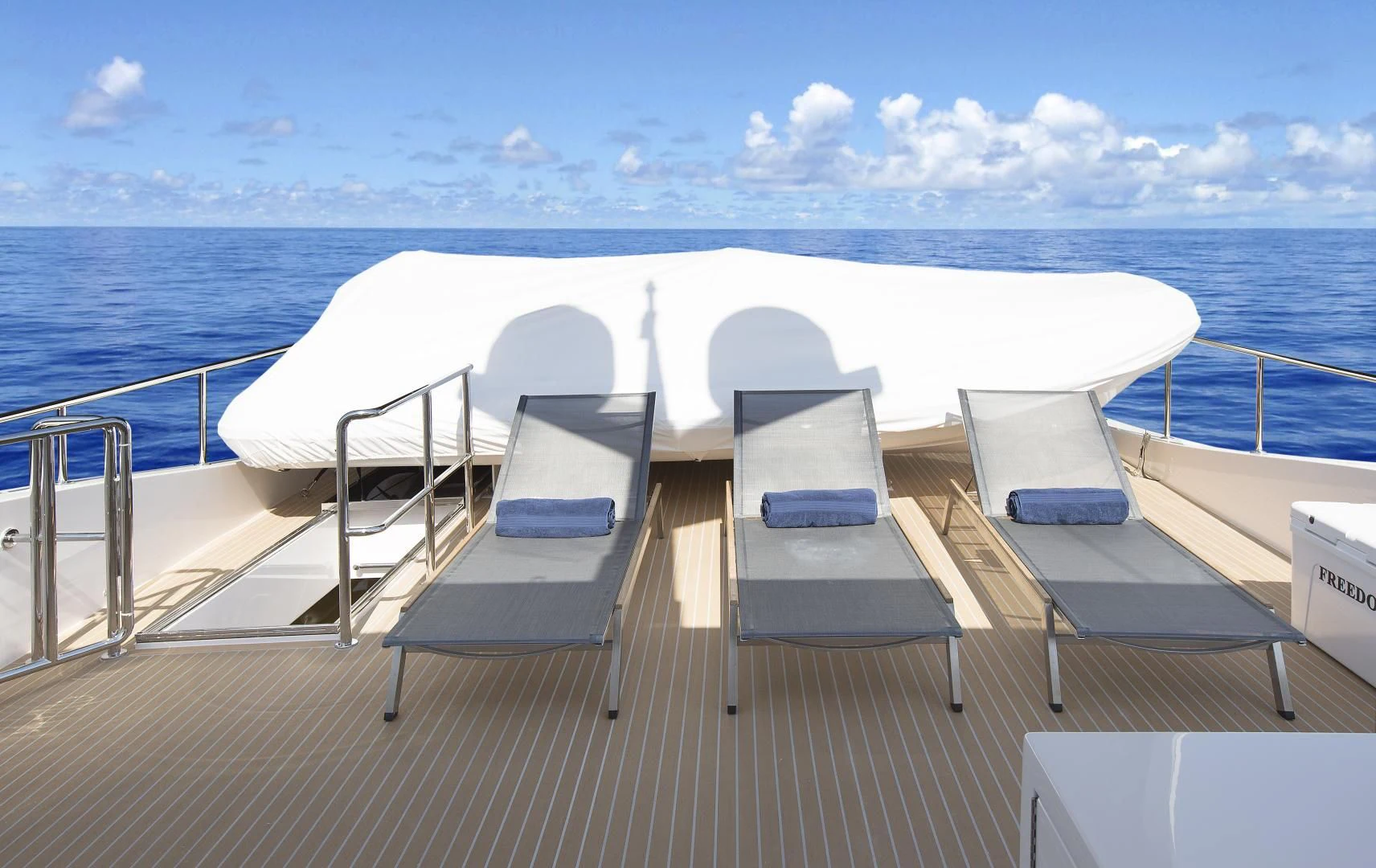 a deck with chairs on it aboard SEASEID Yacht for Sale