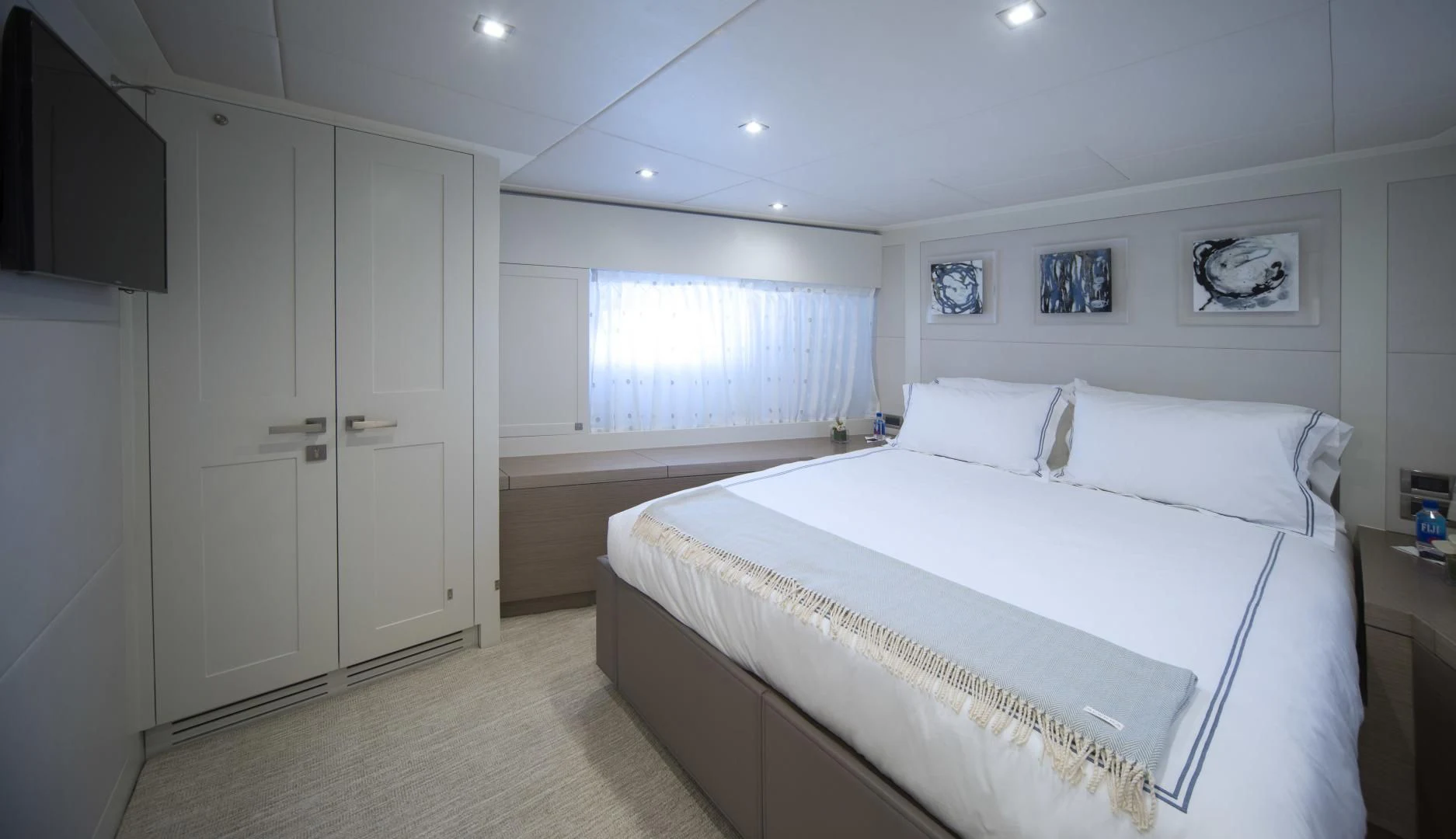 a bedroom with a bed and a closet aboard SEASEID Yacht for Sale