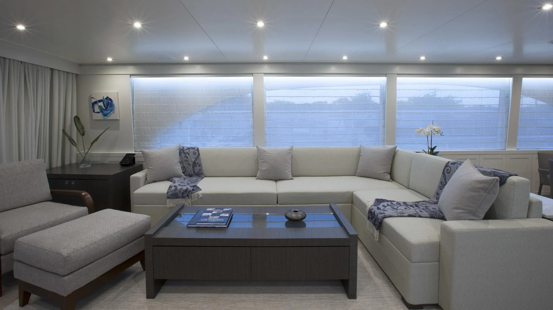 a living room with a large window aboard SEASEID Yacht for Sale