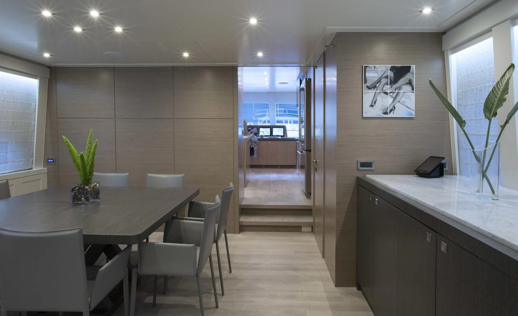 a large empty room with a table and chairs aboard SEASEID Yacht for Sale