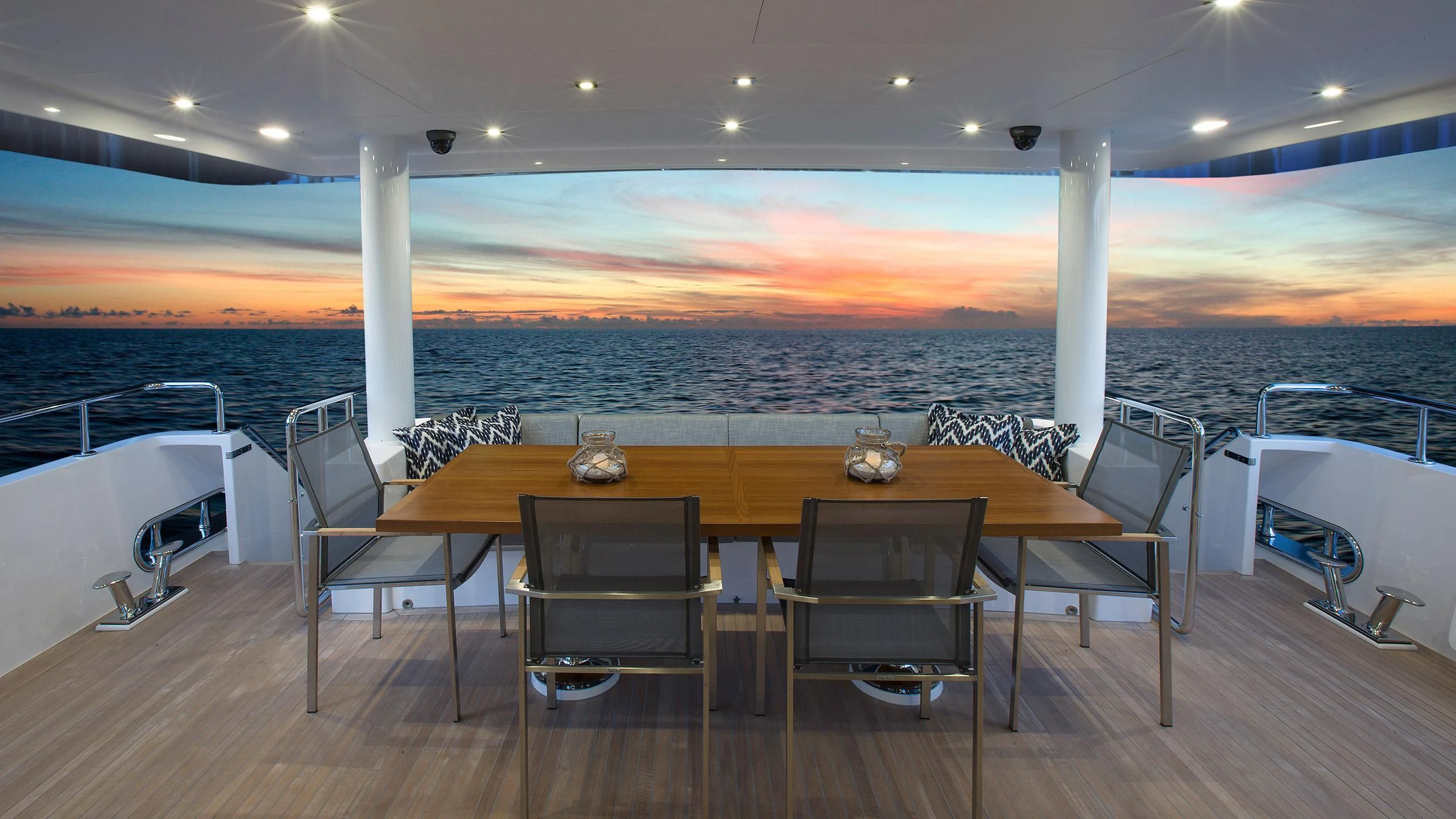 a table and chairs on a deck aboard SEASEID Yacht for Sale
