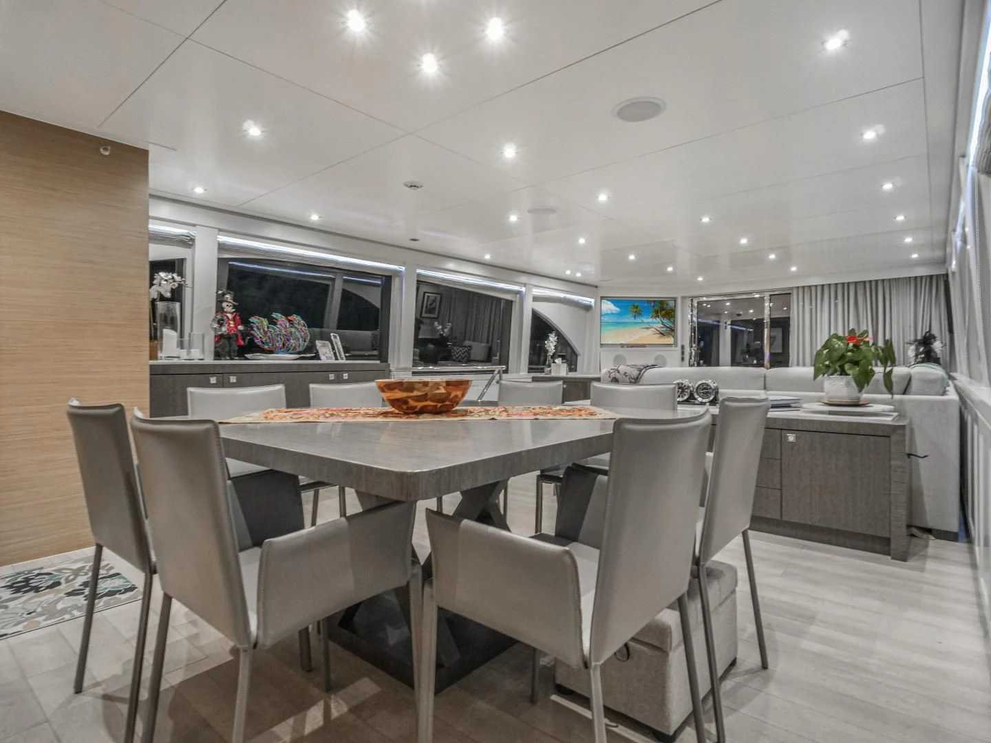 a kitchen with white chairs and a table with white chairs aboard SEASEID Yacht for Sale