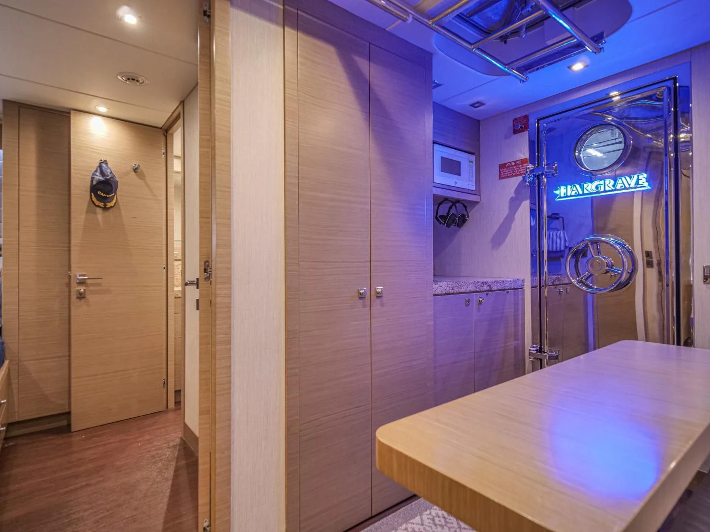 a room with a table and a door aboard SEASEID Yacht for Sale