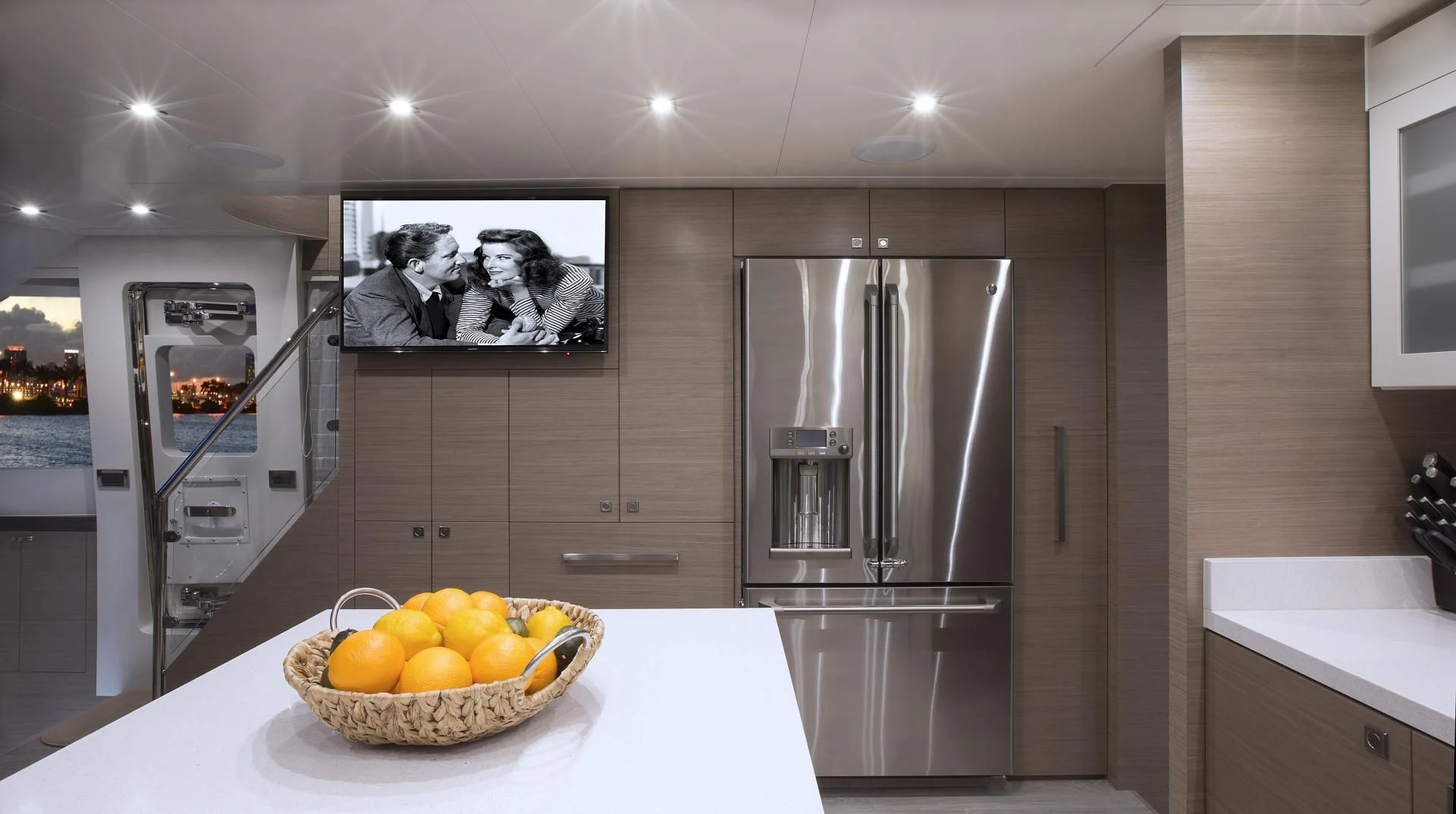 a kitchen with a stainless steel refrigerator aboard SEASEID Yacht for Sale