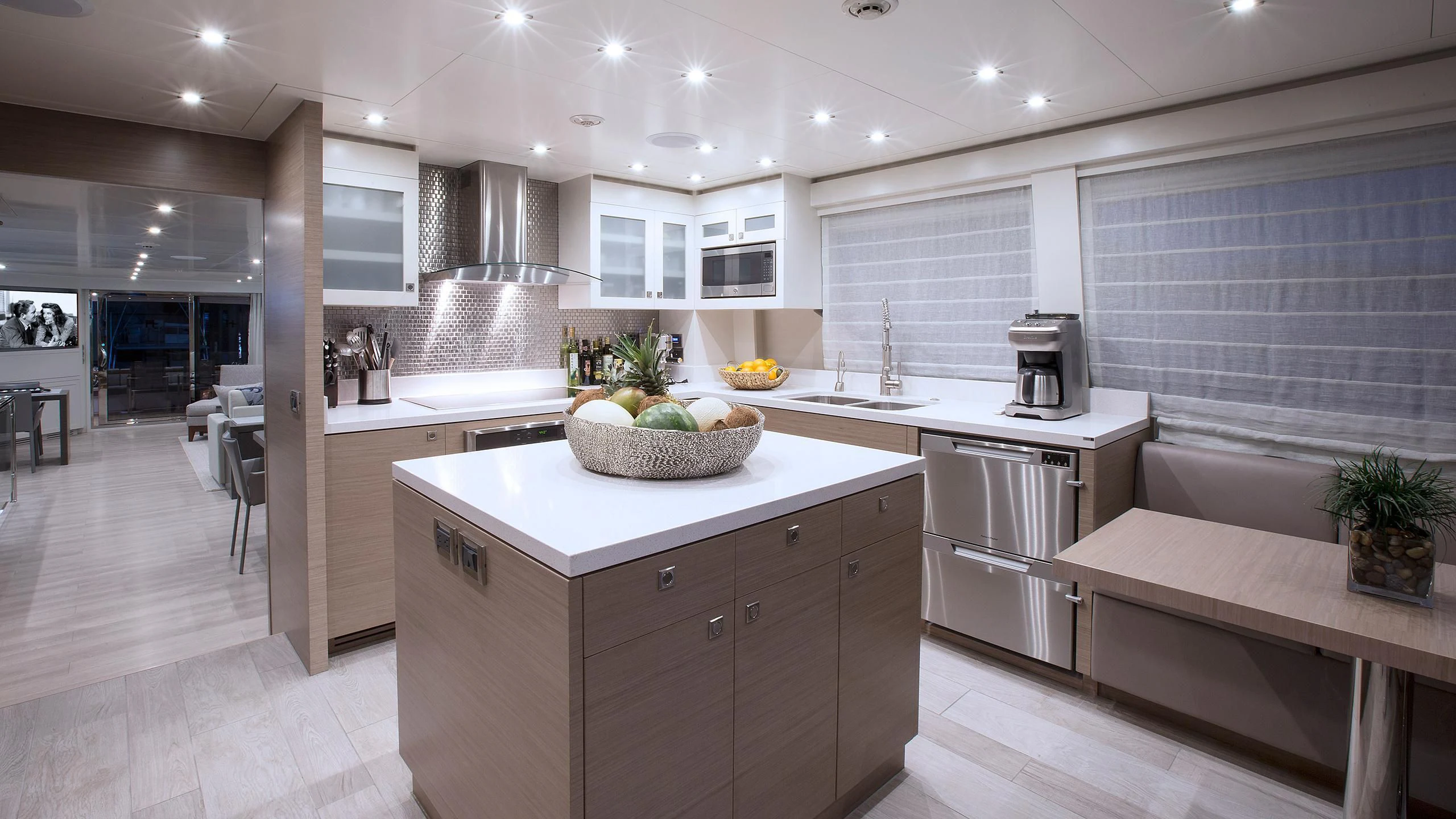 a kitchen with white cabinets aboard SEASEID Yacht for Sale