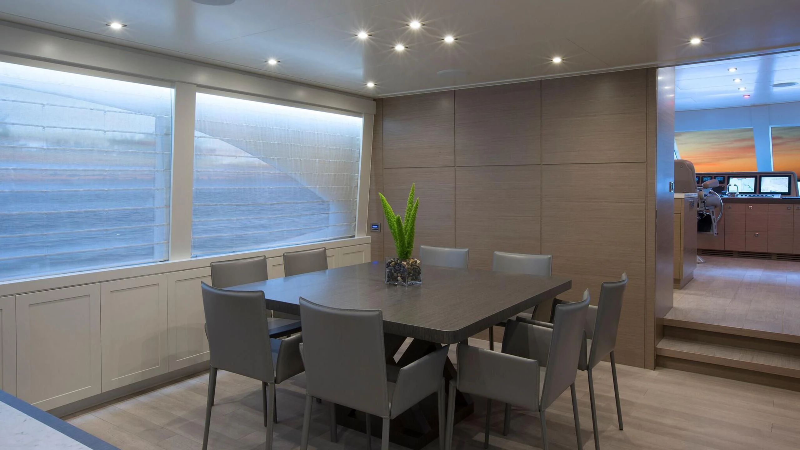 a large conference room with a table and chairs aboard SEASEID Yacht for Sale