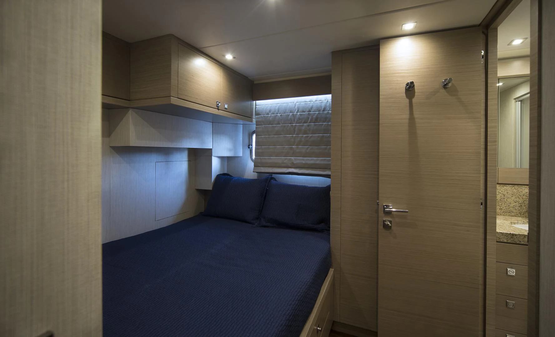a bedroom with a bed and a closet aboard SEASEID Yacht for Sale
