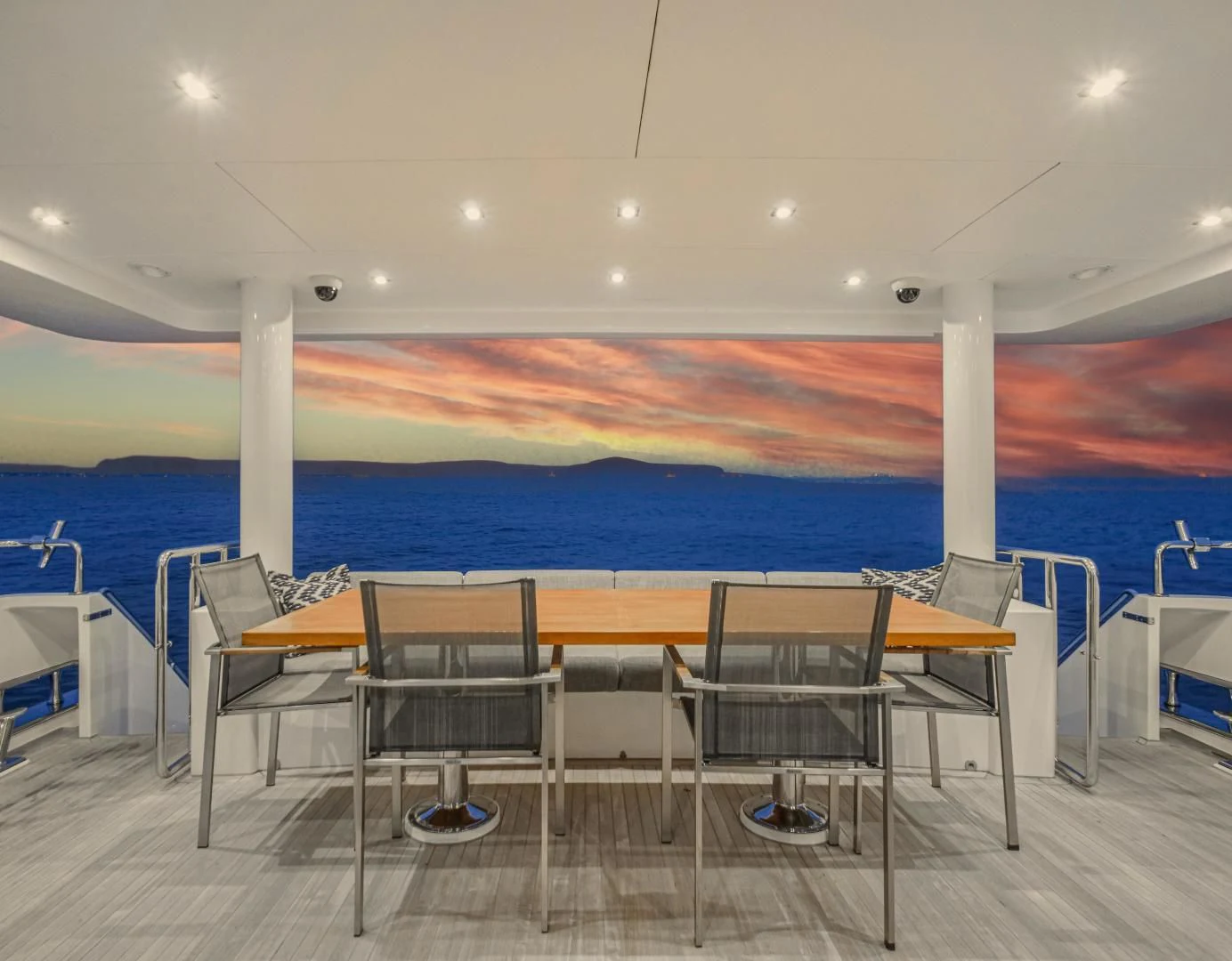 a pool with tables and chairs aboard SEASEID Yacht for Sale