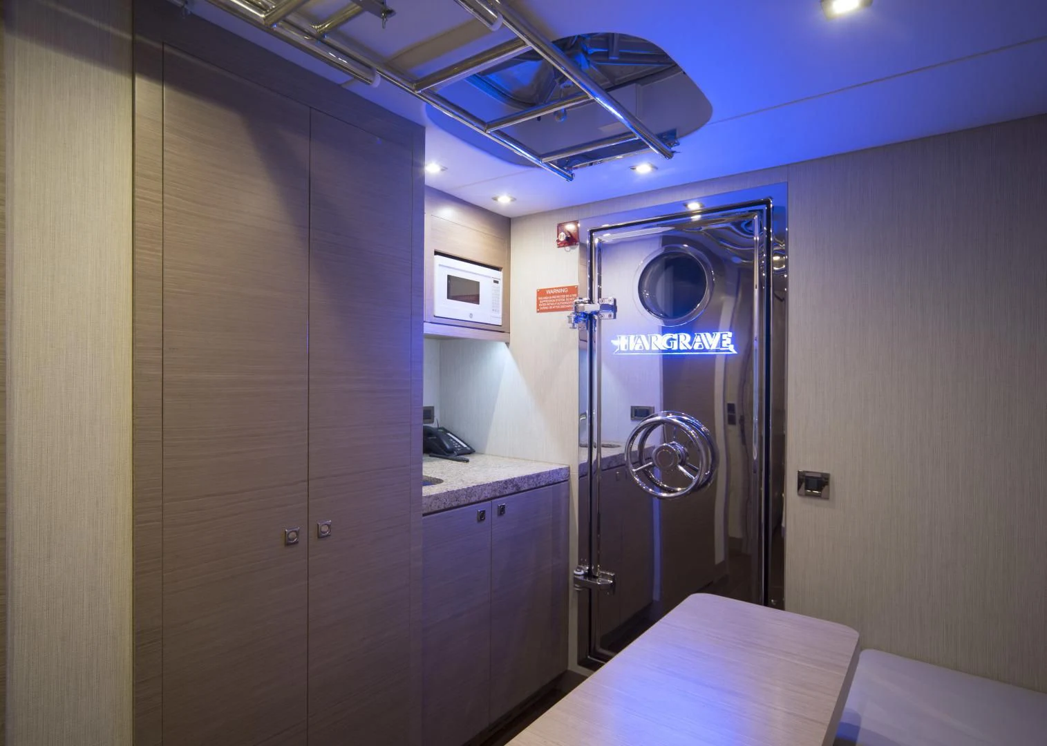 a room with a table and a door aboard SEASEID Yacht for Sale