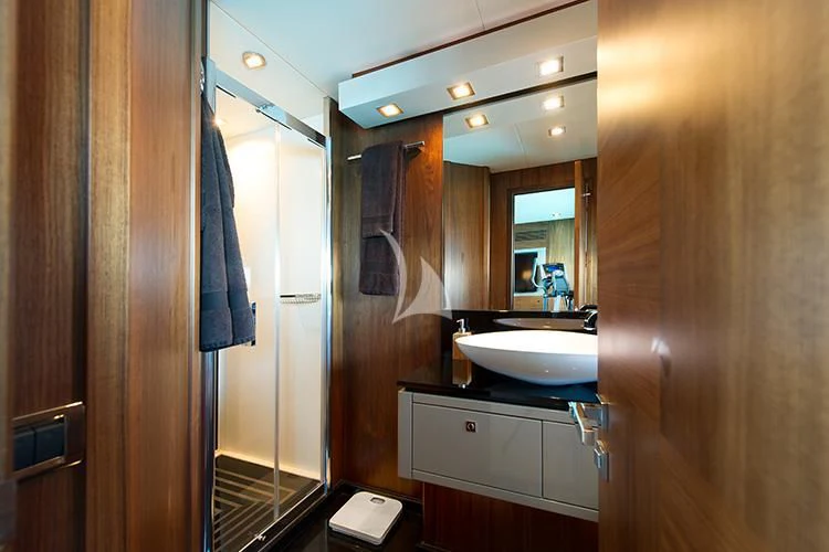 a bathroom with a sink and a mirror aboard NEMESIS Yacht for Sale