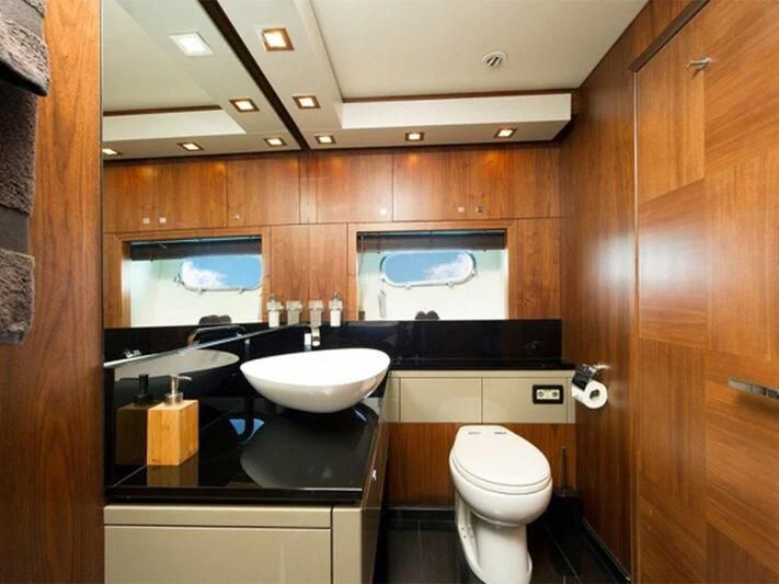 a bathroom with a sink and a toilet aboard NEMESIS Yacht for Sale