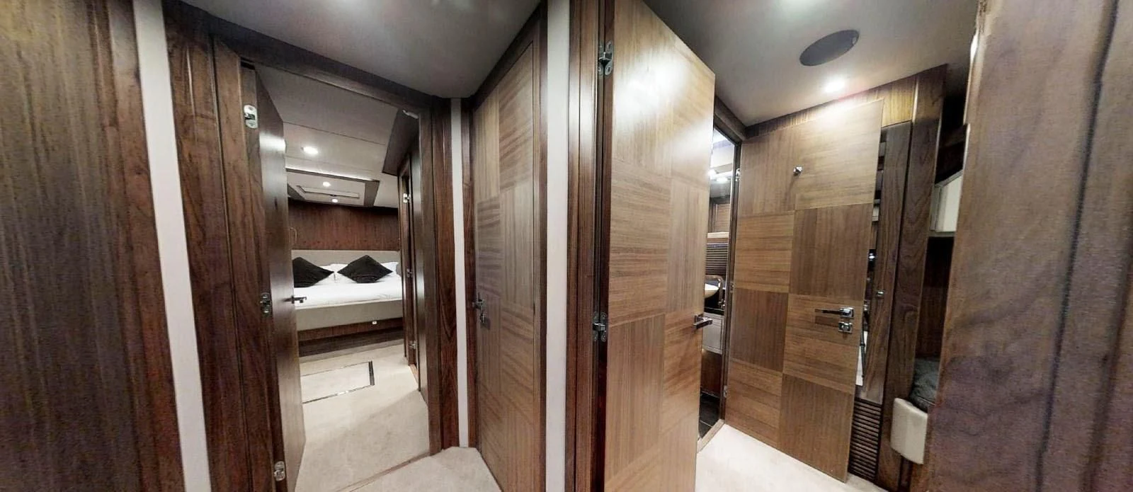 a room with wooden doors aboard NEMESIS Yacht for Sale