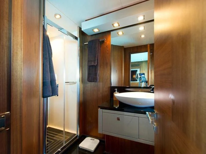 a bathroom with a sink and a mirror aboard NEMESIS Yacht for Sale