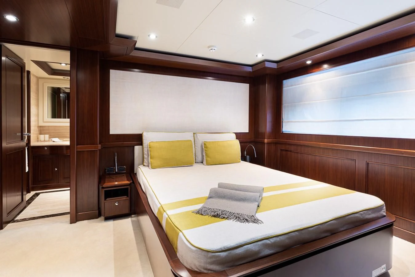 a bed in a room aboard PALATIAL Yacht for Sale