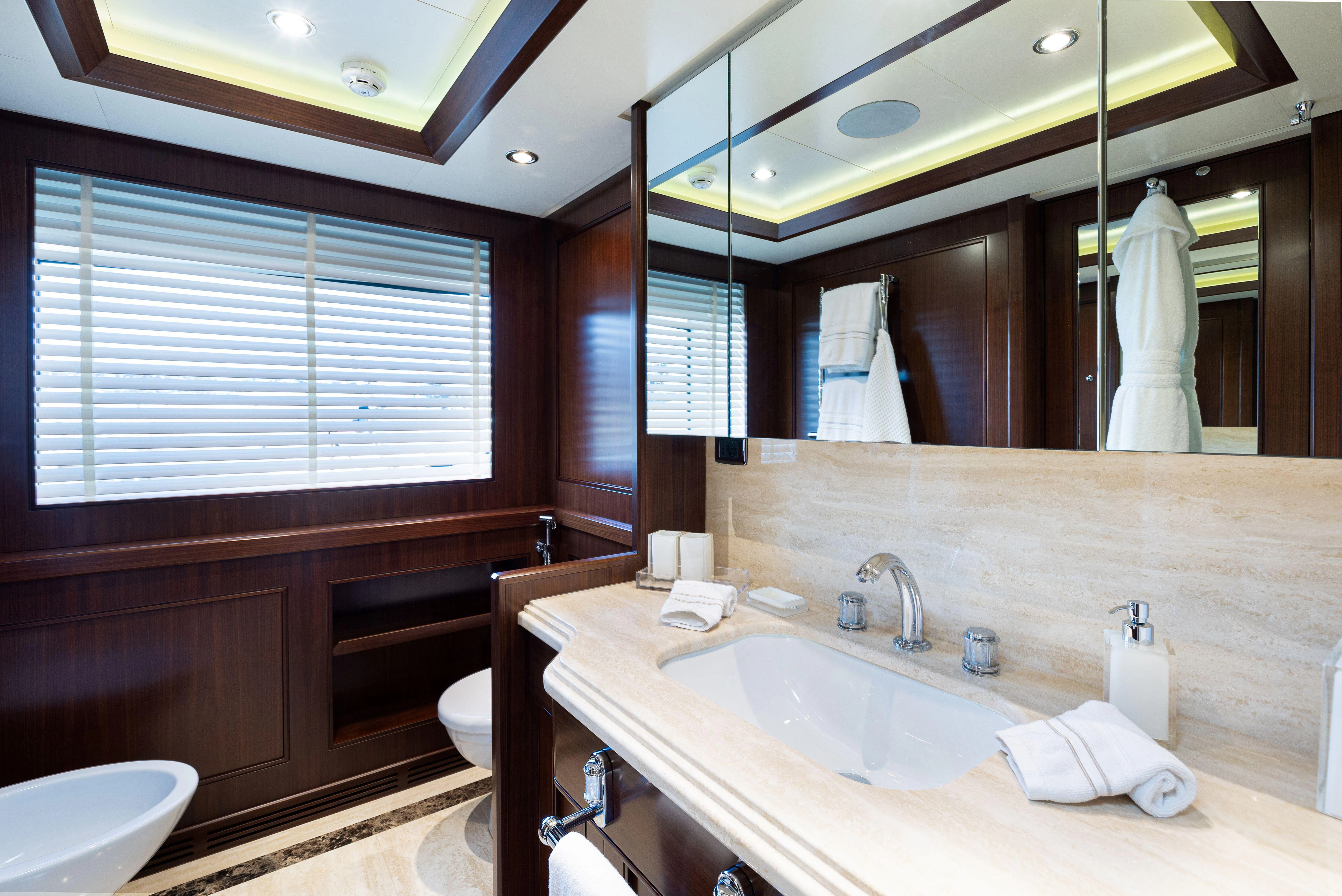 a bathroom with a large mirror aboard PALATIAL Yacht for Sale