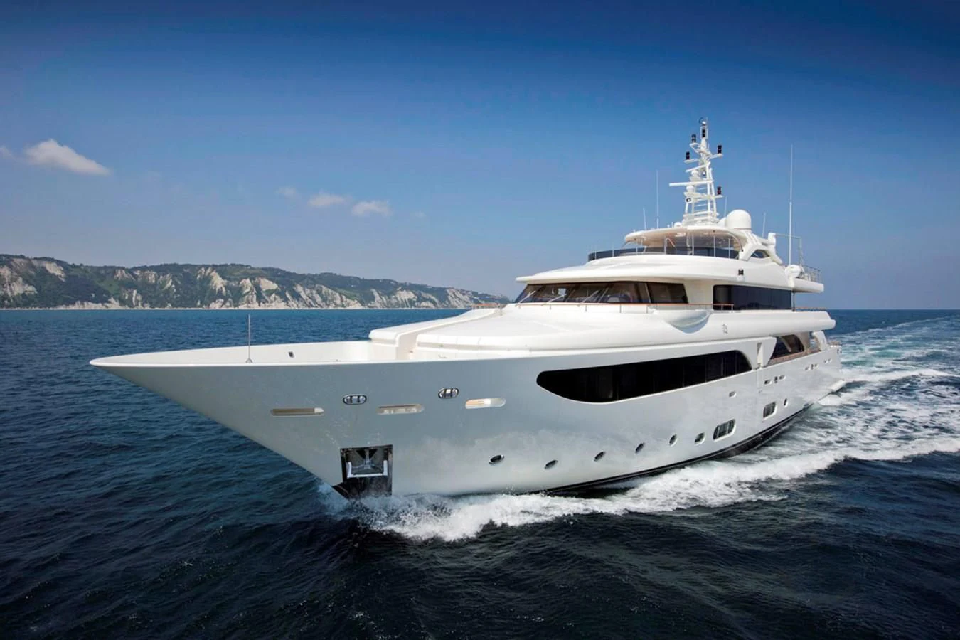 a white yacht on the water aboard PALATIAL Yacht for Sale