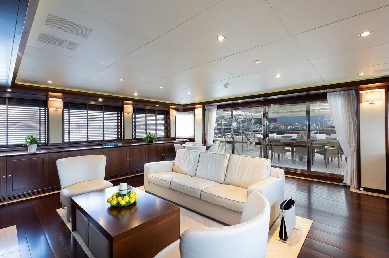 a room with a couch and a table aboard PALATIAL Yacht for Sale
