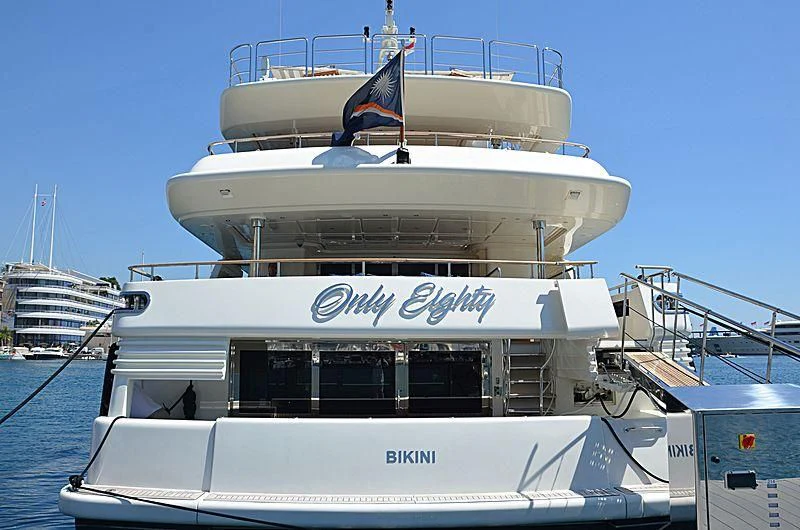 a large white boat with a blue stripe on the front aboard PALATIAL Yacht for Sale