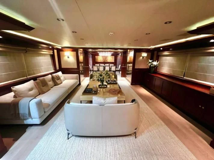 a room with a couch and a table aboard PALATIAL Yacht for Sale