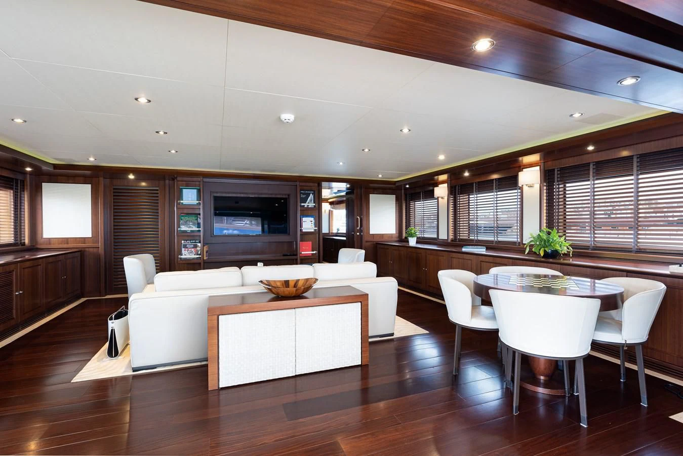 a large room with tables and chairs aboard PALATIAL Yacht for Sale