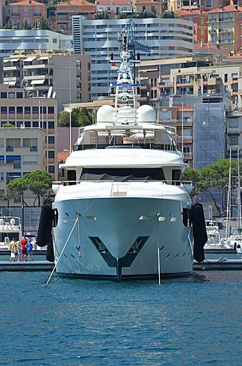 a large white boat in a harbor aboard PALATIAL Yacht for Sale