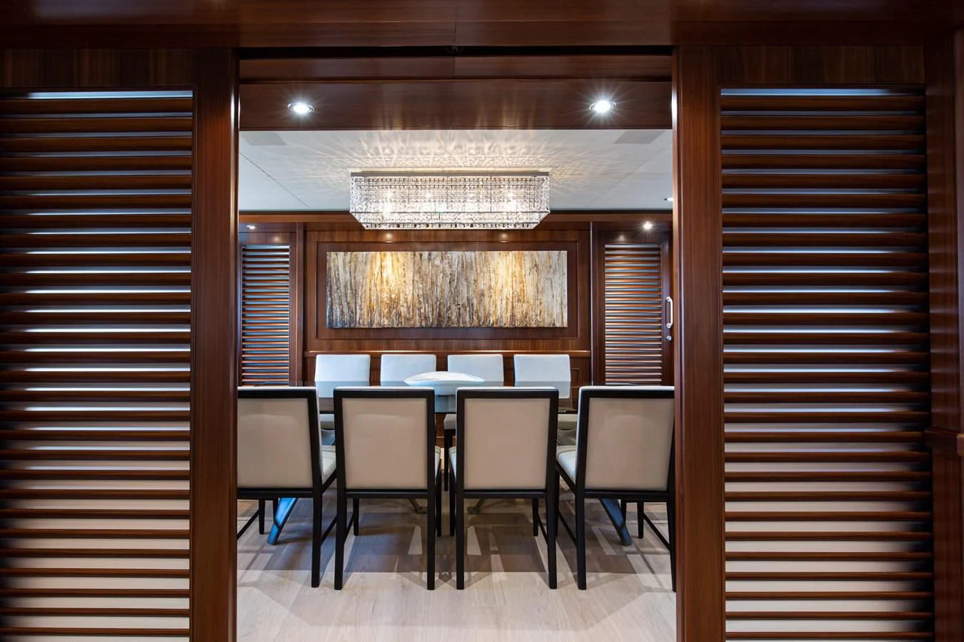 a room with a table and chairs aboard PALATIAL Yacht for Sale