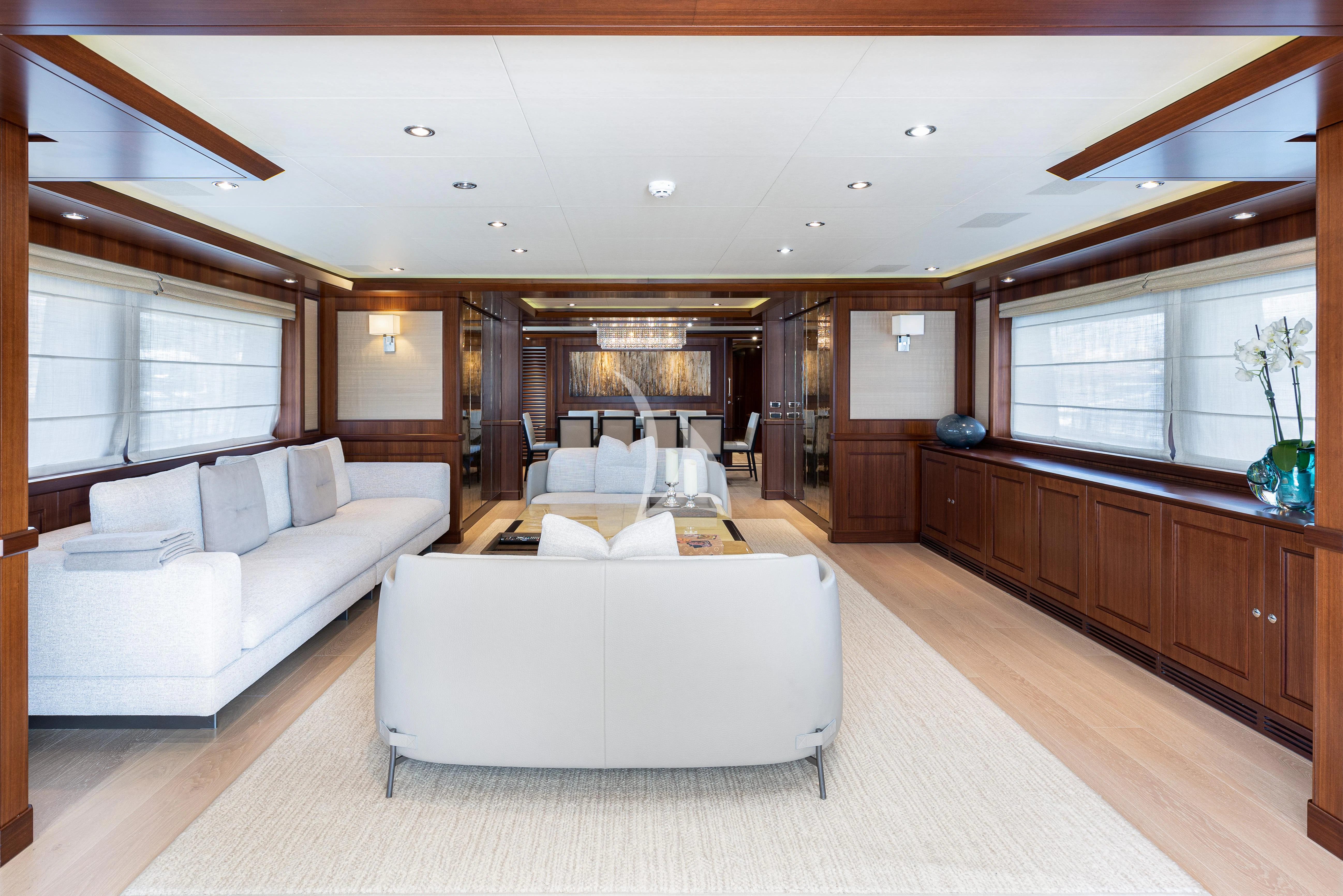 a living room with a couch and a table aboard PALATIAL Yacht for Sale